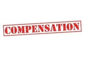 COMPENSATION red Rubber Stamp over a white background.